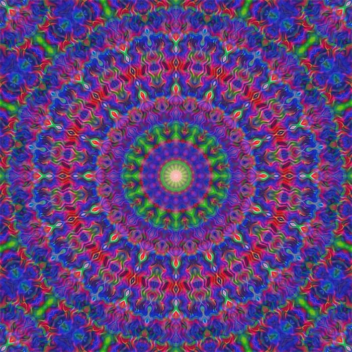 Farbintensive Mandala mit geometrischen Formen in Violett, Grün, Rosa und Blau – fördert spirituelle Verbundenheit, Harmonie und emotionale Offenheit.